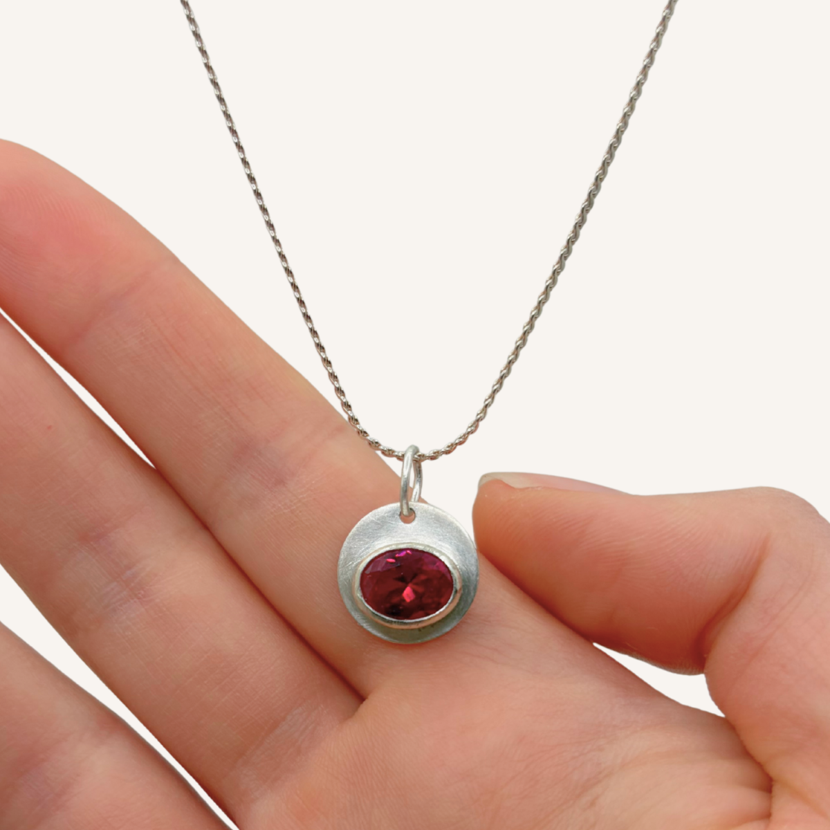 Modern style silver bezel set lab-grown pink ruby necklace