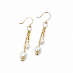 Gold- filled bridal earrings with pearl drops on a white background
