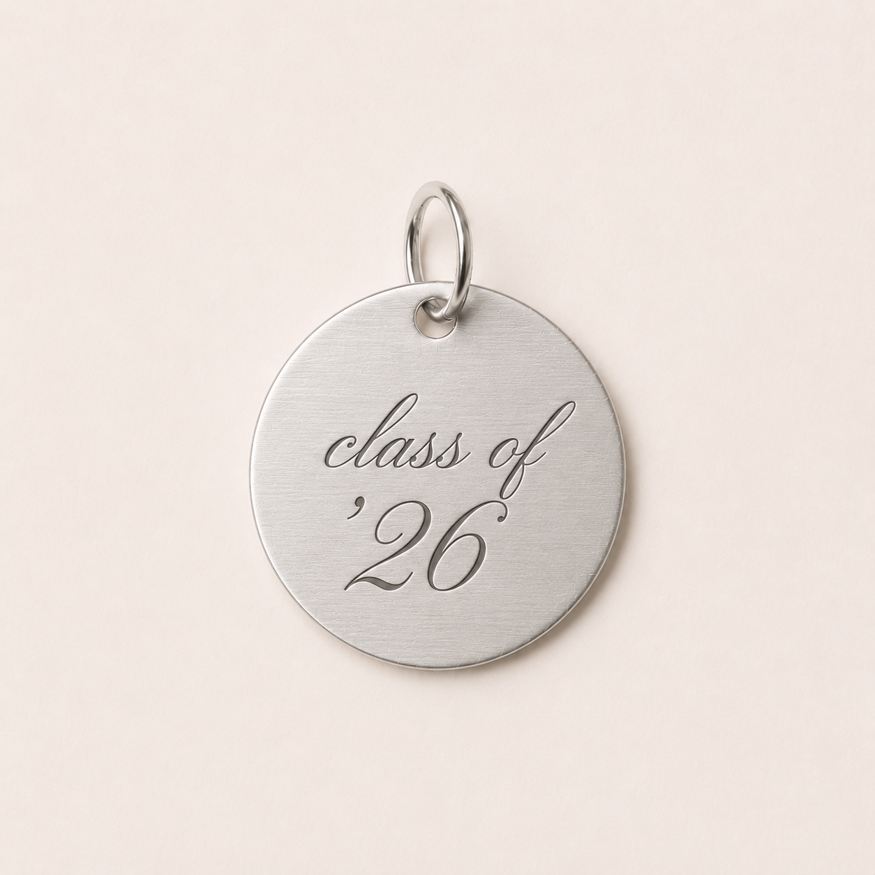 Silver pendant with 'class of '26' engraving 