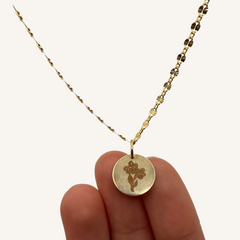 Gold-filled birth flower necklace with a medium sized pendant and February birth flower.