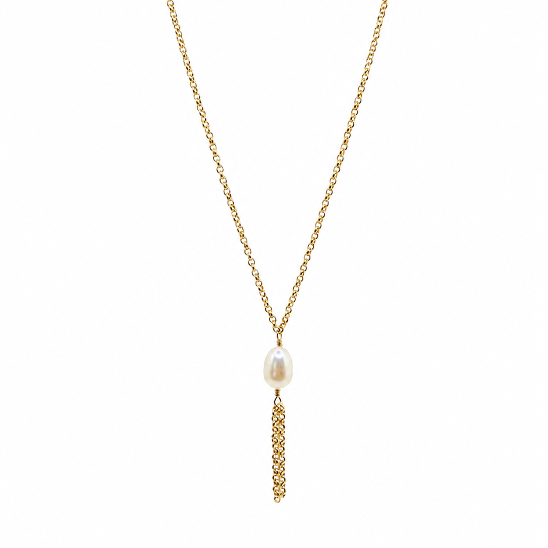 A thick gold chain necklace featuring a single white freshwater pearl pendant, with a vertical textured gold drop below it.