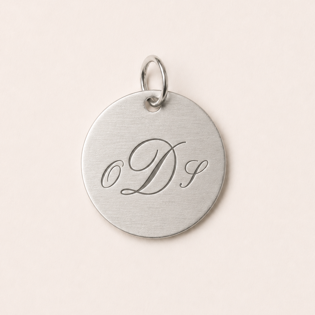 Silver pendant with engraved initials 