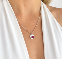 silver bezel set lab grown ruby pendant on silver chain