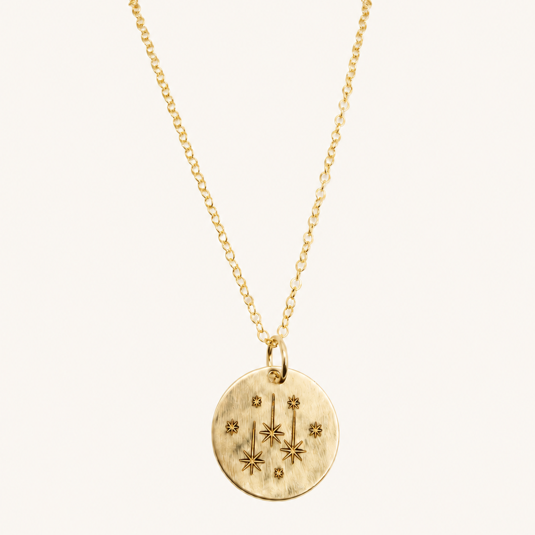 gold chain with gold engraved star pendant