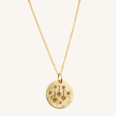 gold chain with gold engraved star pendant