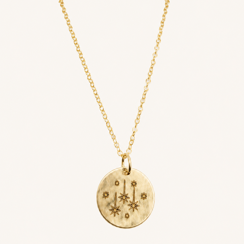 gold chain with gold engraved star pendant