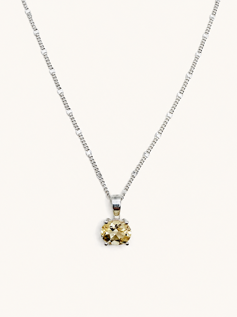 Silver necklace with an oval yellow citrine