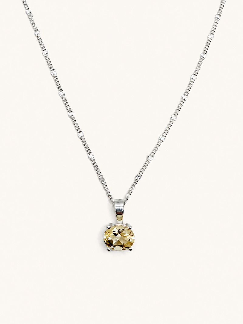 Silver necklace with an oval yellow citrine