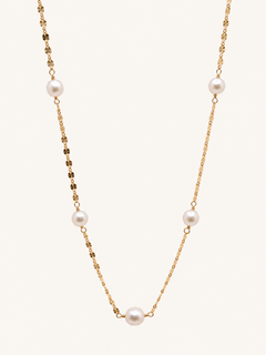 A delicate gold chain necklace featuring five evenly spaced white freshwater pearls